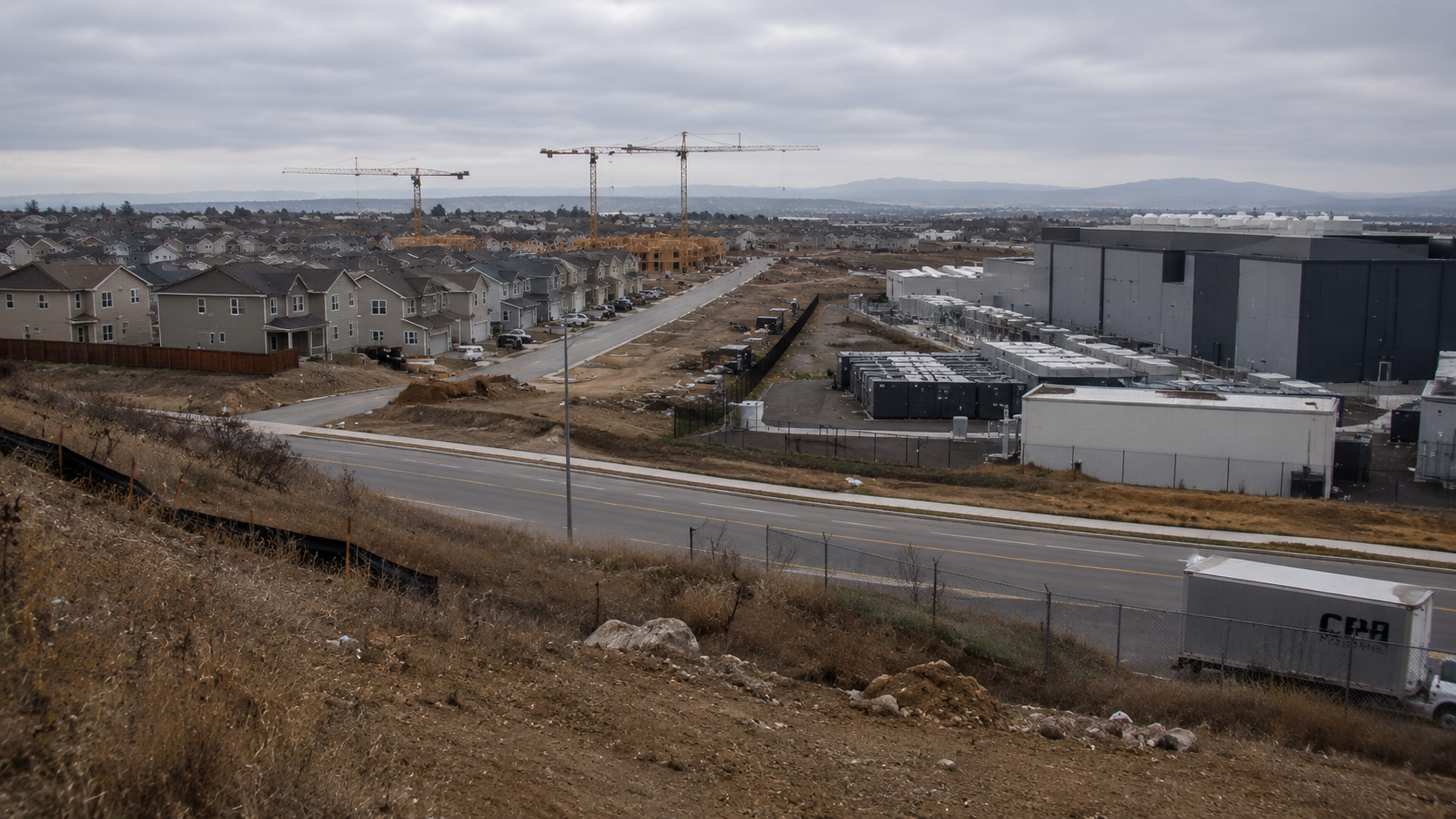 Cover image for What Big Builders Get Wrong About Housing showing a modest new-construction subdivision at blue hour, starter homes and partially finished lots, construction materials and curb lines visible, realistic American suburb.